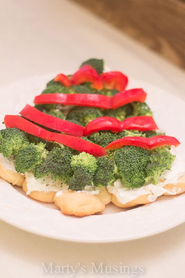 A plate of food with broccoli, with Christmas tree and Party