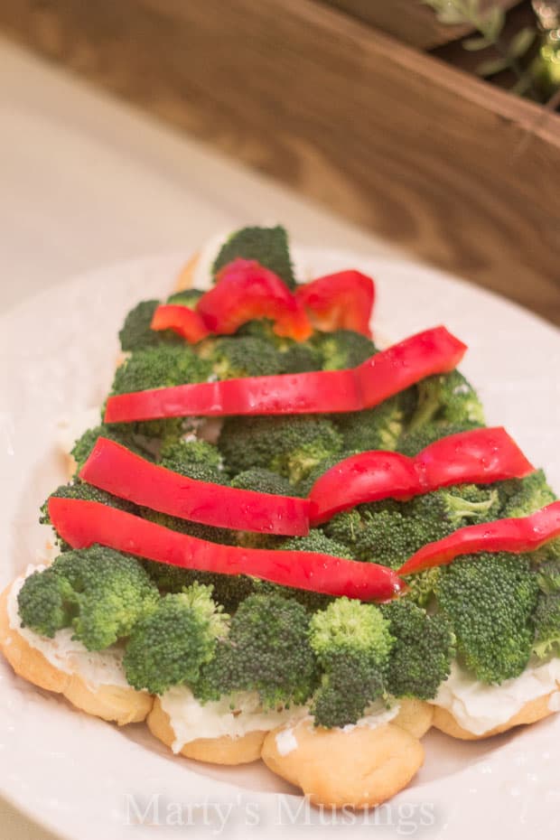 A plate of food with broccoli, with Christmas tree