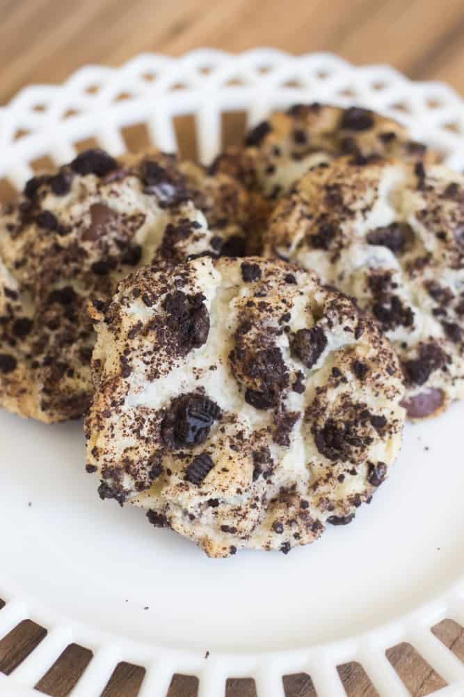 A piece of cake on a plate, with Cookie and Chocolate chip