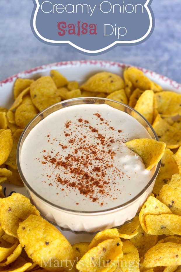 A plate of food and a cup of coffee, with Cream and Onion