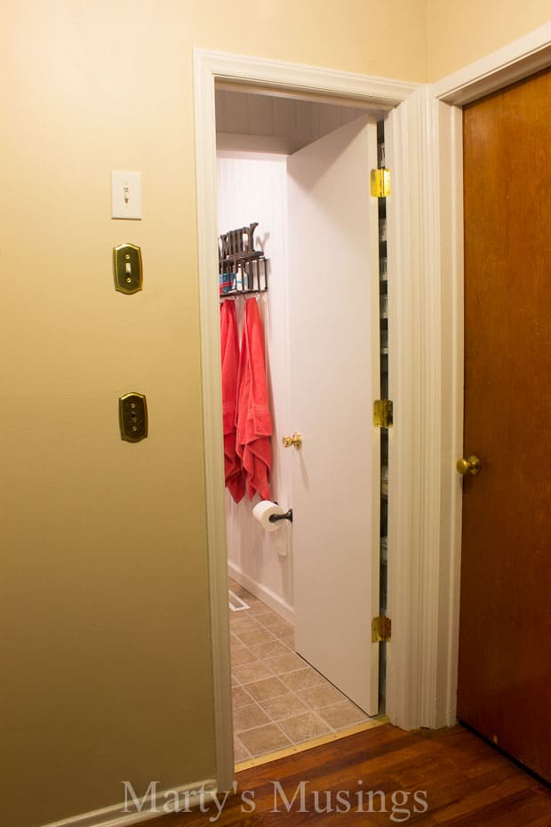 A bedroom with a large mirror