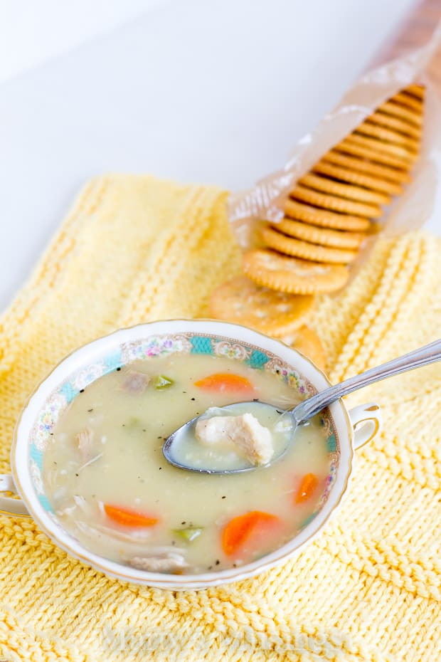 A bowl of soup and a spoon