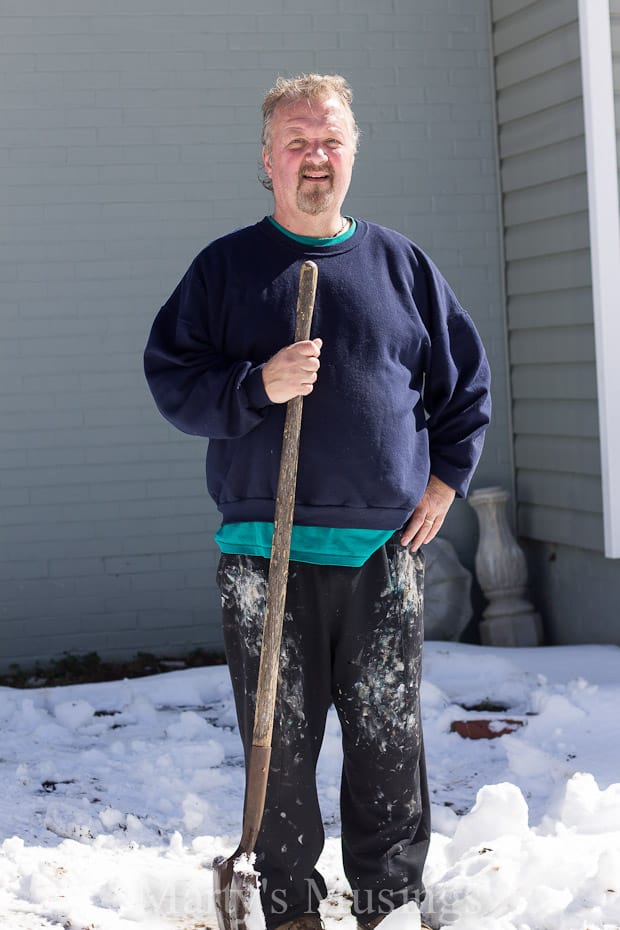 A man that is standing in the snow