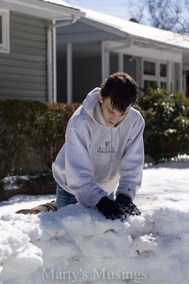 A man that is standing in the snow