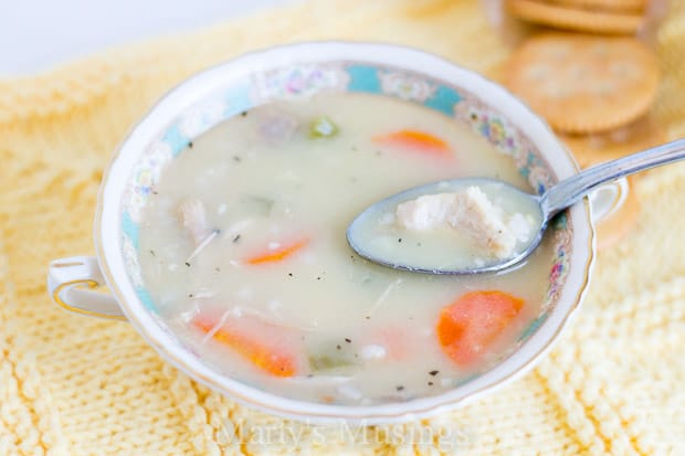 A bowl of food on a plate, with Soup and Family