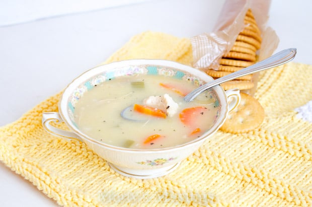 A bowl of food on a plate, with Cooker and Soup