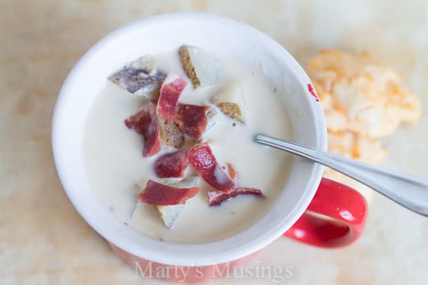 A bowl of food on a plate, with Slow cooker and Soup