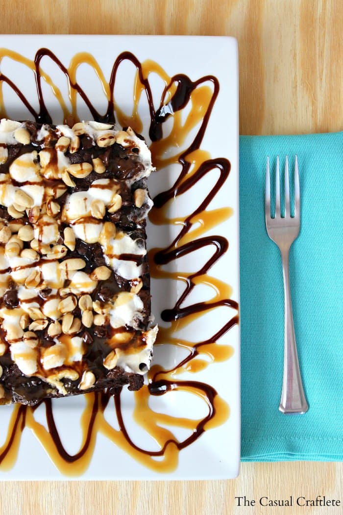 A piece of cake on a plate, with Chocolate and Cookie