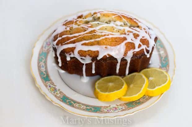 A dessert on a plate, with Bread and Lemon