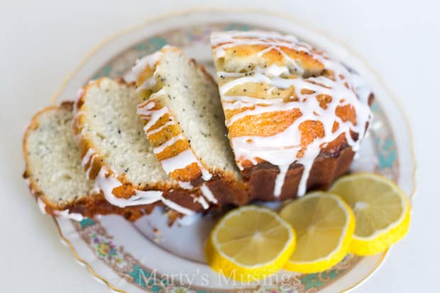 A slice of cake on a plate, with Poppy seed