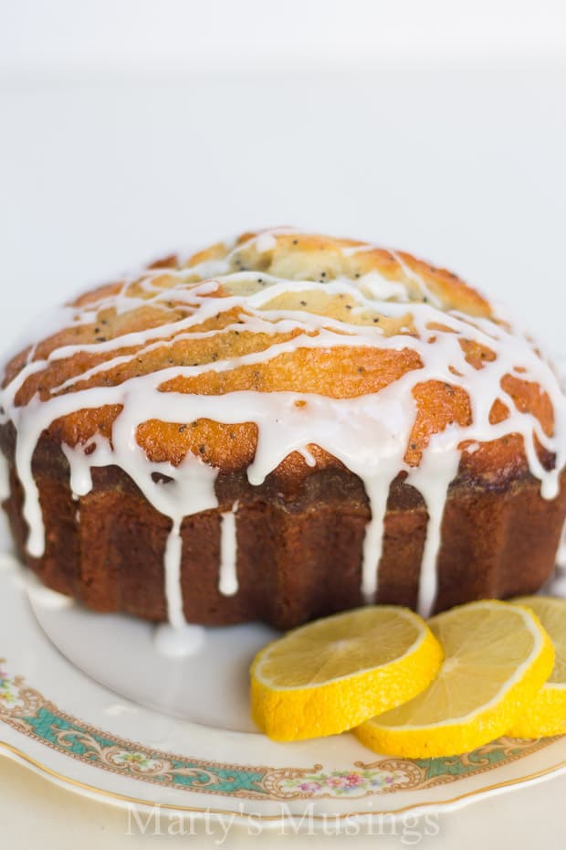 A piece of cake on a plate, with Bread and Lemon