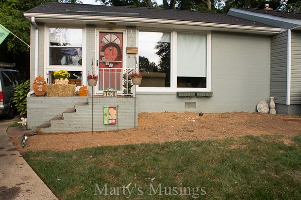 A fire hydrant in front of a house