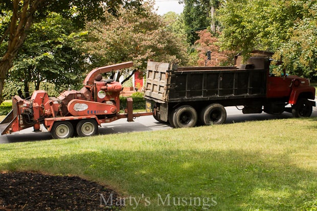 A truck driving down a dirt road