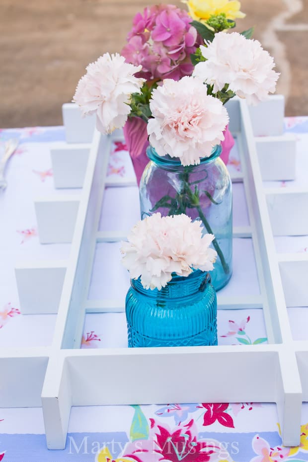 A vase filled with pink flowers on a table