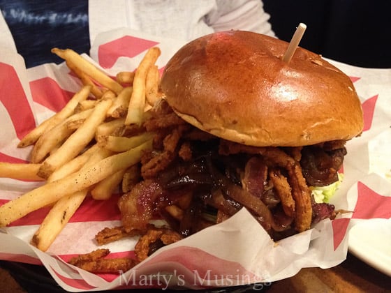 A sandwich sitting on top of a pile of fries