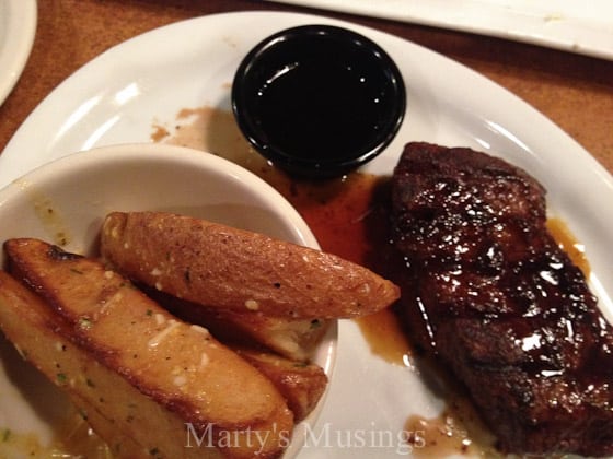 A plate of food, with Steak and Rib