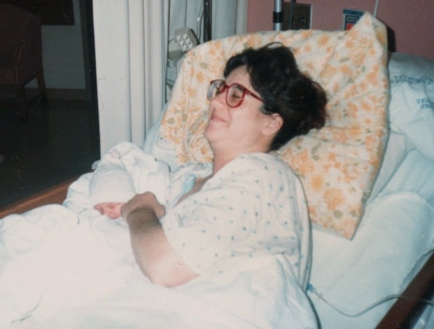 A person sitting on a bed