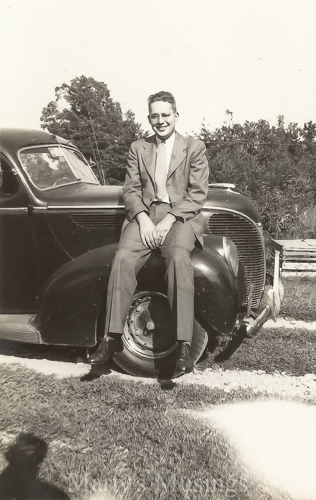 A person sitting in a car posing for the camera