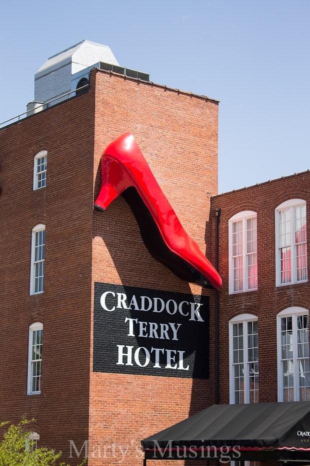 A sign in front of a brick building