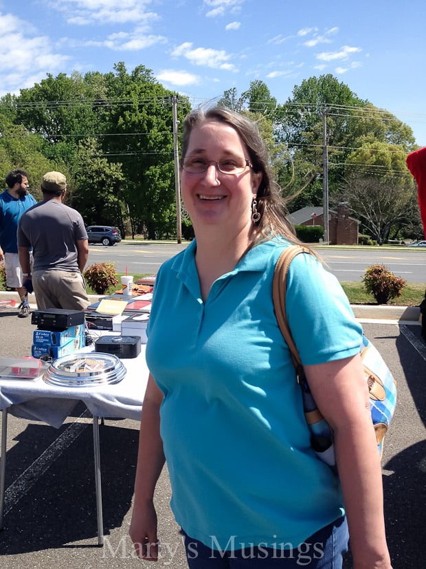 A person standing in front of a picnic table