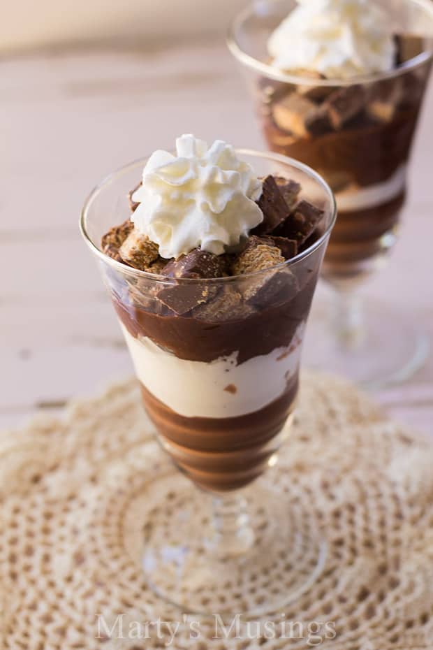 A cup of coffee on a table, with Chocolate and Crunch