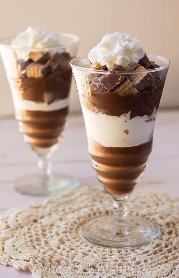 A close up of a glass cup on a table, with Chocolate and Crunch
