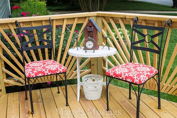 An umbrella sitting on top of a wooden chair