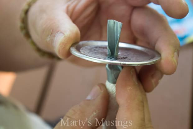 pulling wick through mason jar lid- Marty's Musings