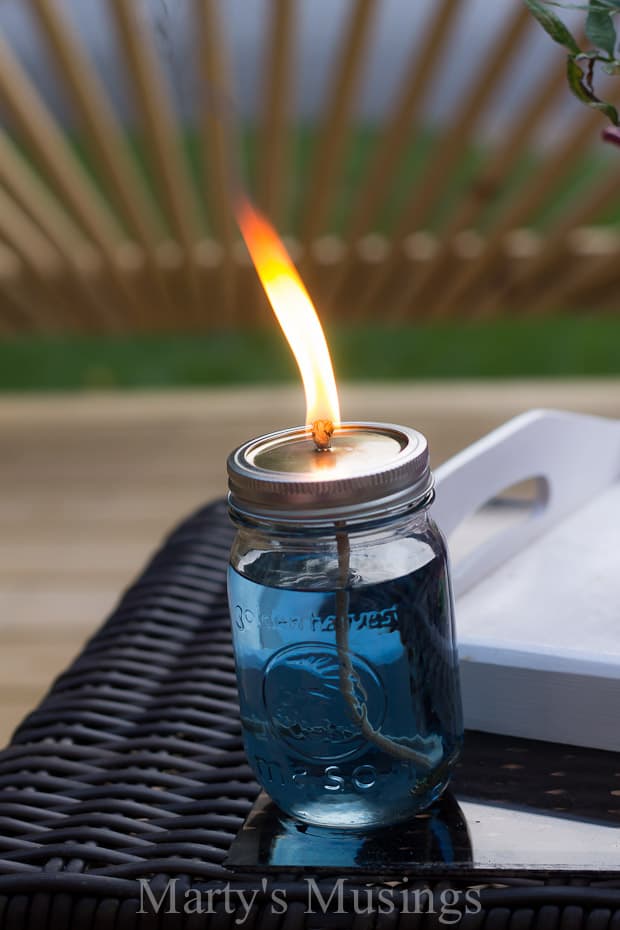 lit Citronella Candle on table 