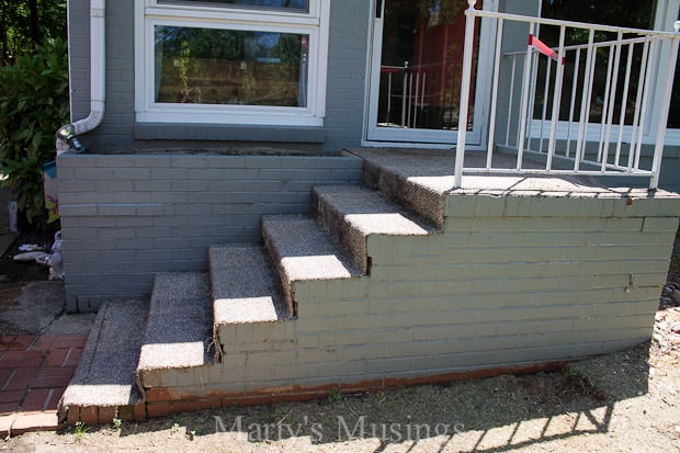 A chair sitting in front of a brick building