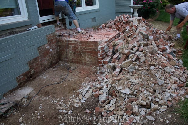 Demolishing brick stoop and stairs on front of house