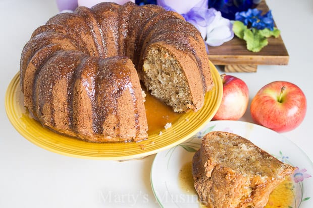 A plate of food on a table, with Cake and Apple