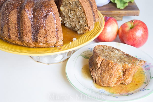 A piece of cake on a plate, with Apple cake