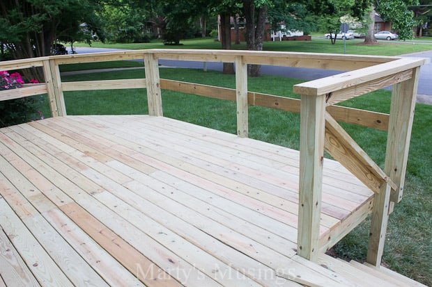 Unfinished deck and railing on front of house