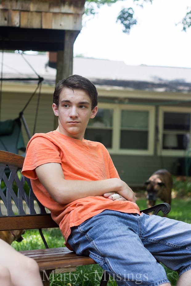A boy sitting on a bench