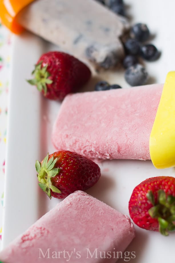 A piece of cake with fruit on top