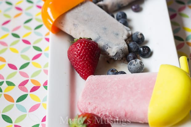 A slice of cake on a plate, with Strawberry and Smoothie