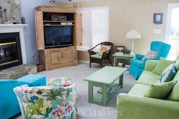 A living room filled with furniture and a fire place