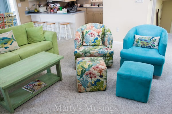 A green sofa in a living room