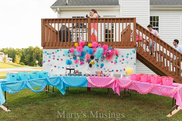 A group of lawn chairs sitting on top of a grass covered field