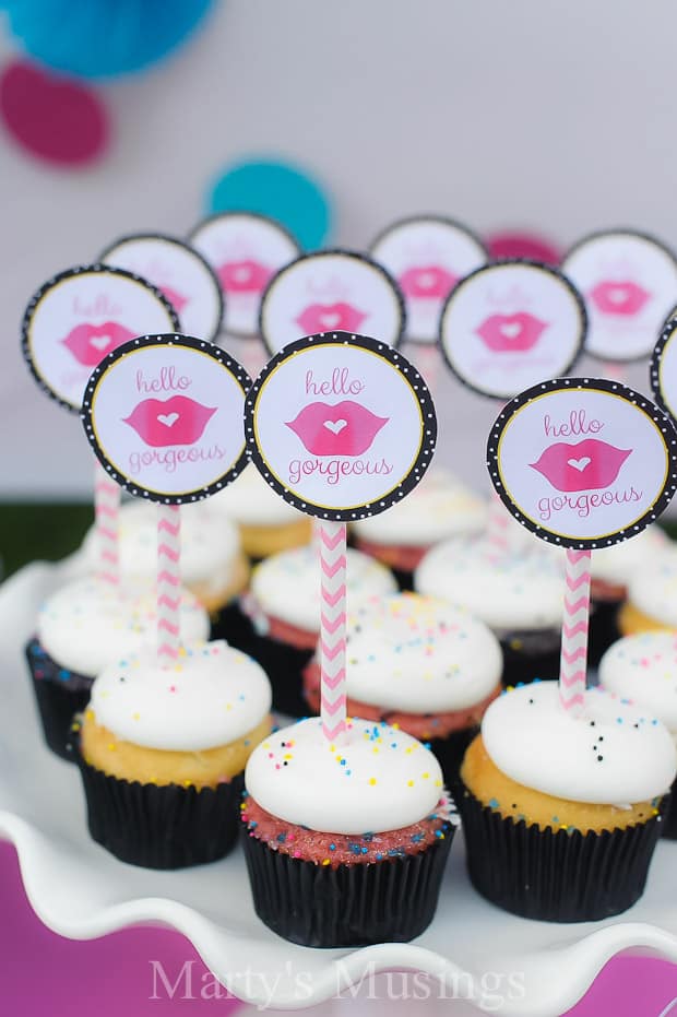 Gender reveal party with pink cupcakes and toppers