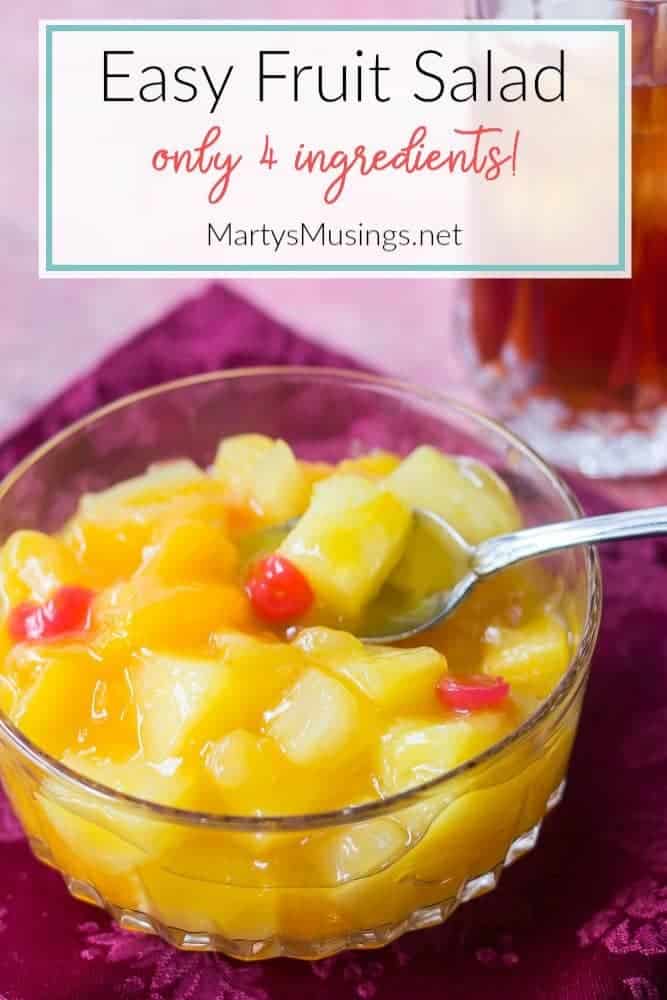 A bowl of fruit, with Salad and Blue cheese dressing