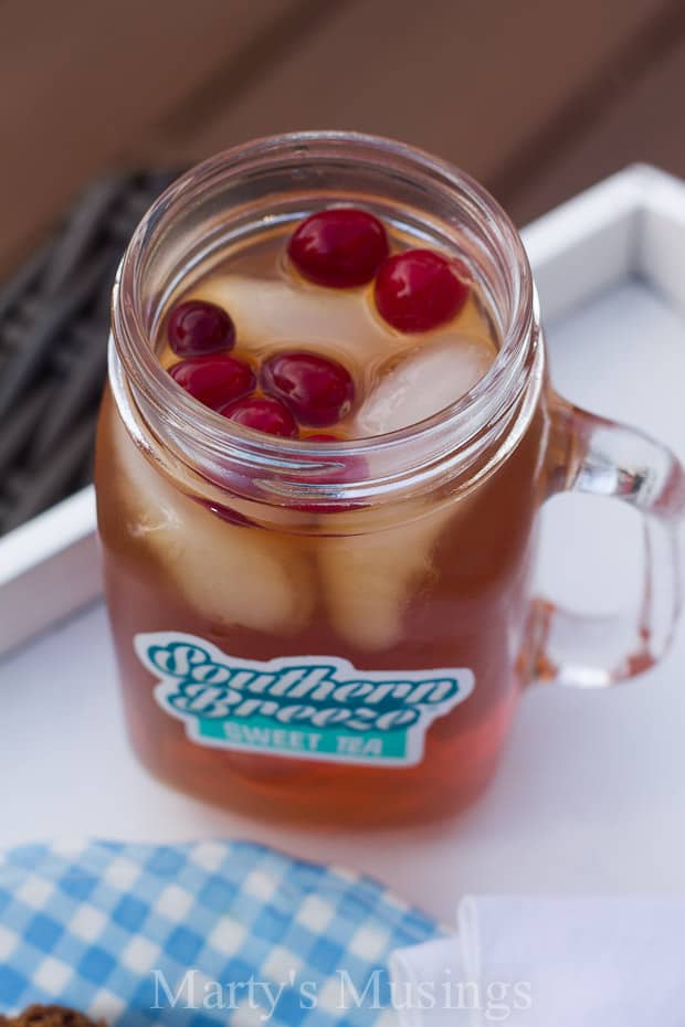 A glass of orange juice, with Sweet tea