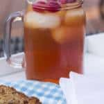 A glass cup on a table, with Tea