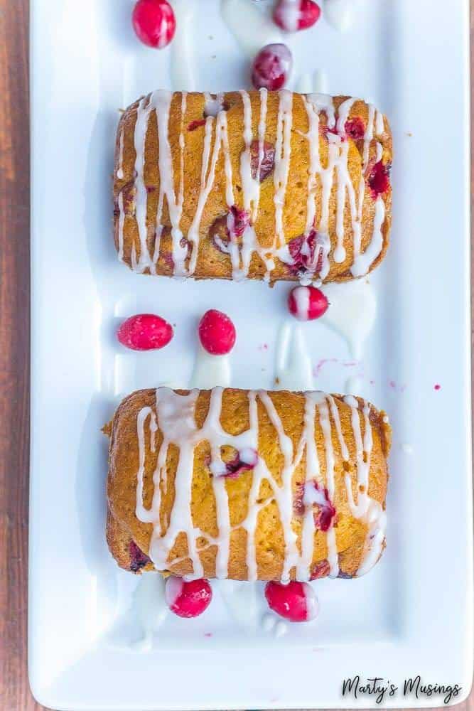 Pumpkin cranberry quick bread on a white plate
