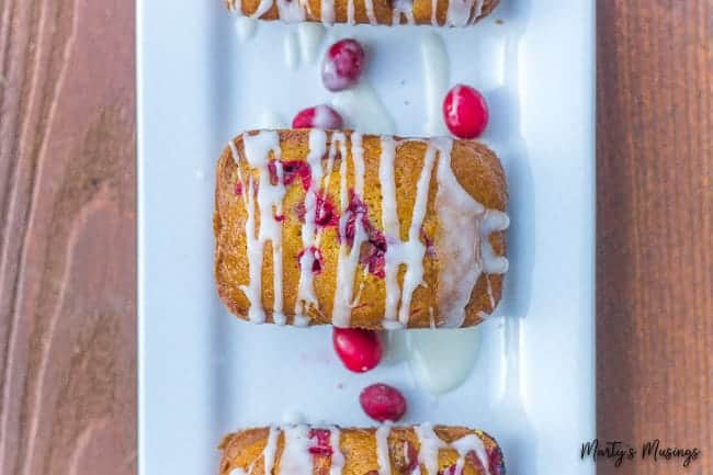 Cranberry pumpkin quick bread on a white plate