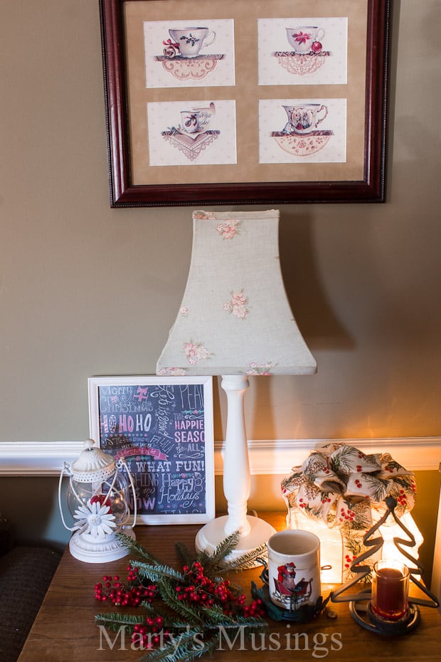 A room filled with furniture and vase of flowers on a table