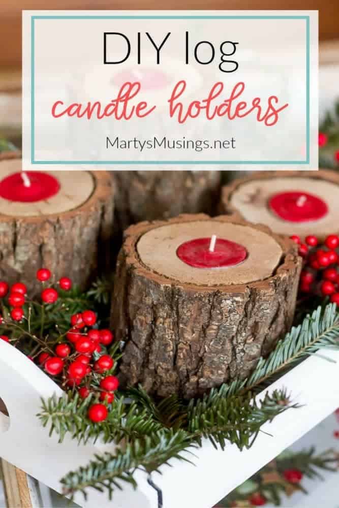 Candle holders made from wood with red candles and berries