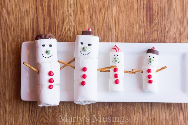 Marshmallow snow people with candy decorations