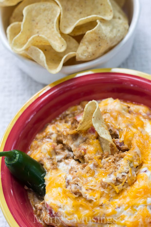 A bowl of food on a plate, with Taco and Spice